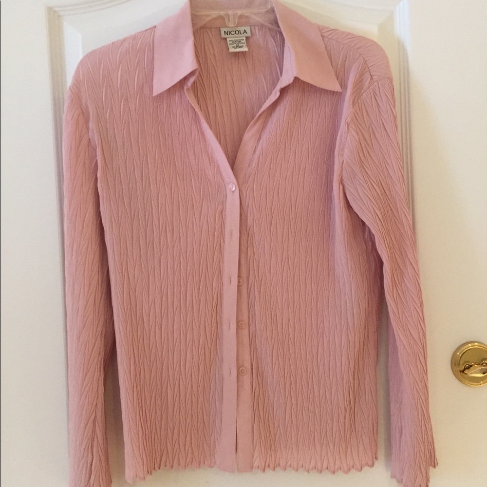 Pretty pink blouse with nice design. Size M.